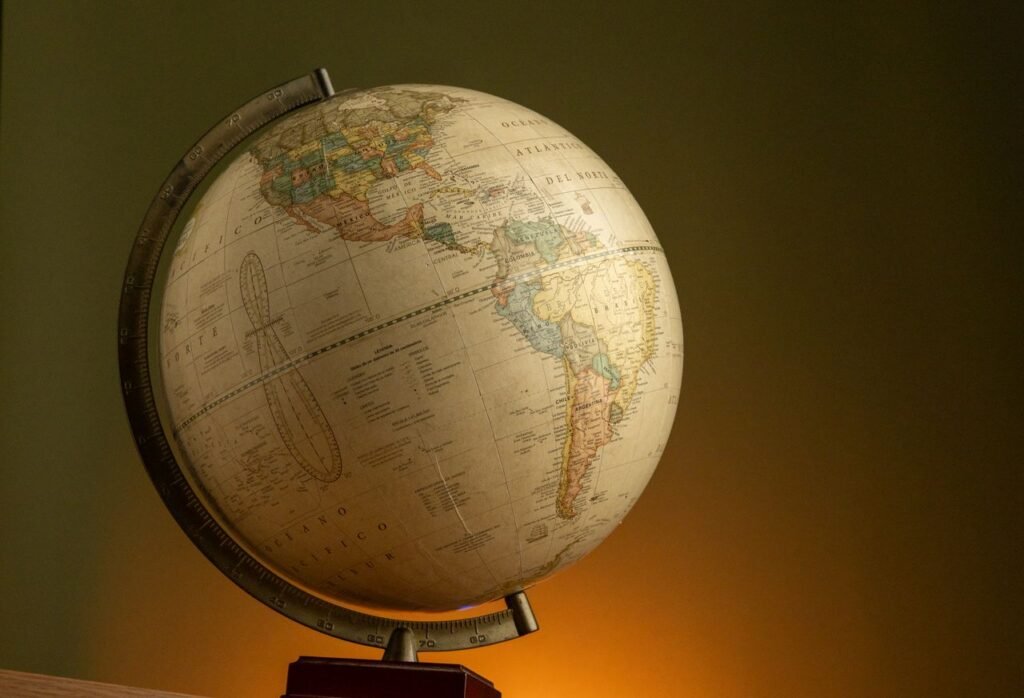 Elegant vintage globe showcasing world geography with a warm ambient background.